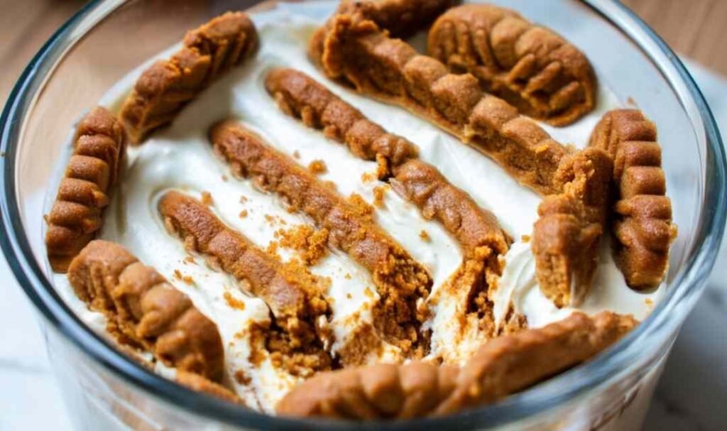 2-ingredient yogurt cheesecake unmolded on a plate topped with fresh berries and honey drizzle