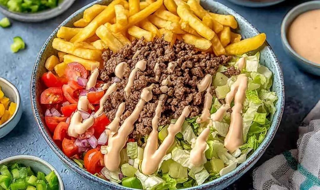 Big Mac bowl with seasoned ground beef, shredded iceberg lettuce, cheddar cheese, and homemade special sauce