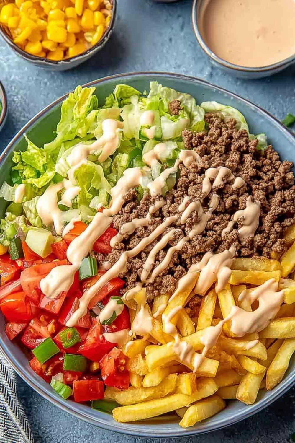 Big Mac bowl with seasoned ground beef, shredded iceberg lettuce, cheddar cheese, and homemade special sauce