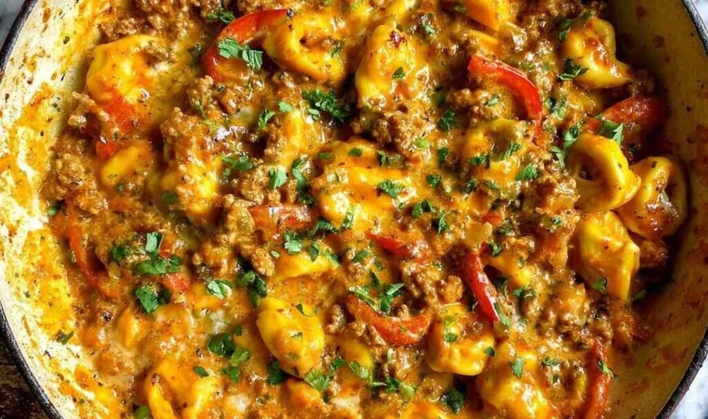 Cheesy one pot beef and potatoes in a nonstick skillet with melted cheddar and fresh parsley