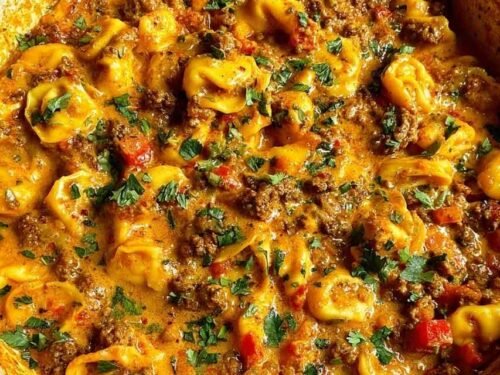 Cheesy one pot beef and potatoes in a nonstick skillet with melted cheddar and fresh parsley