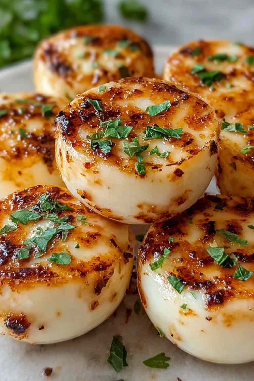 Freshly baked high protein egg white bites cooling on a wire rack with visible spinach and cheese filling