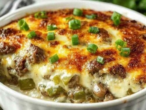 Low carb Philly cheesesteak casserole fresh from the oven with golden bubbly melted cheese on top