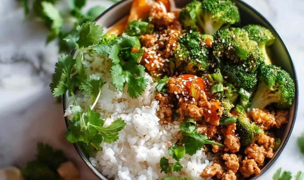 Sweet and spicy ground turkey broccoli bowls with honey sriracha sauce over brown rice