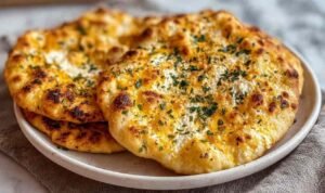 Viral Cottage Cheese Flatbread Golden-edged viral cottage cheese flatbread on a parchment-lined baking sheet just out of the oven with a matte fully set surface