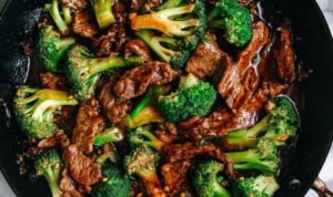 Chinese Beef and Broccoli with glossy brown sauce served over steamed white rice