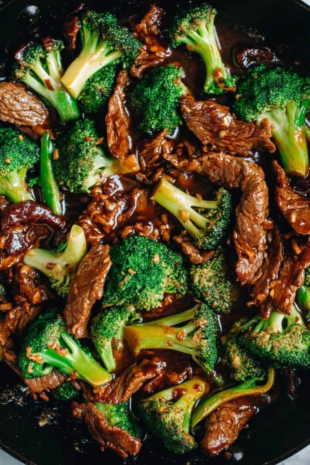 Chinese Beef and Broccoli with glossy brown sauce served over steamed white rice