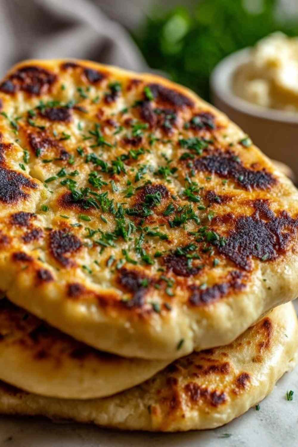 Healthy cottage cheese flatbread on a parchment-lined baking tray with golden edges and firm center fresh from the oven