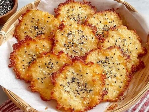 Crispy easy keto cottage cheese chips golden and baked on a parchment-lined baking sheet