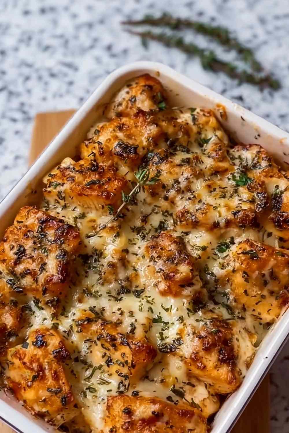 High protein creamy garlic cheesy chicken and potatoes in a large skillet with golden seared chicken, tender potatoes, and creamy Parmesan garlic sauce