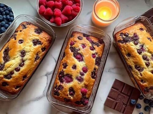 High protein pancake bowl baked in a ramekin topped with fresh blueberries and raspberries