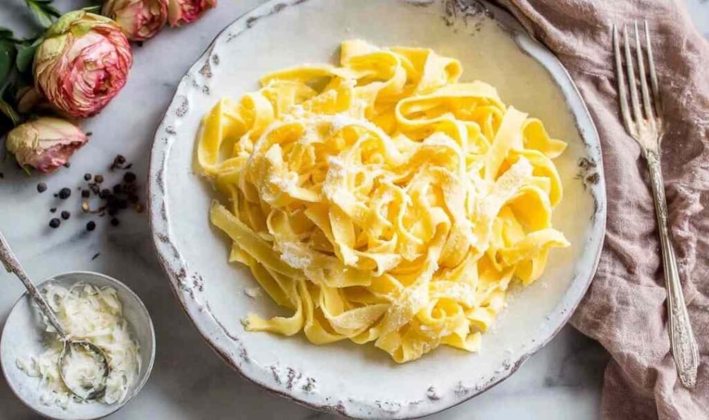 Homemade keto egg noodles made with almond flour served in a white bowl